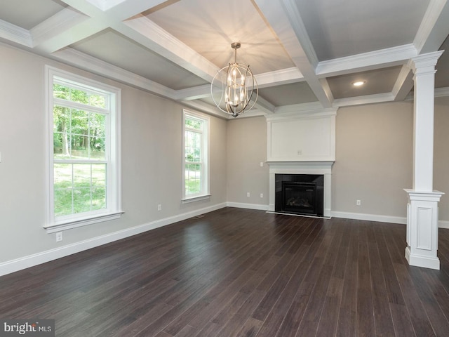 unfurnished living room with plenty of natural light, dark wood finished floors, and baseboards