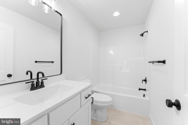 full bathroom featuring tile patterned flooring, vanity, toilet, and bathing tub / shower combination