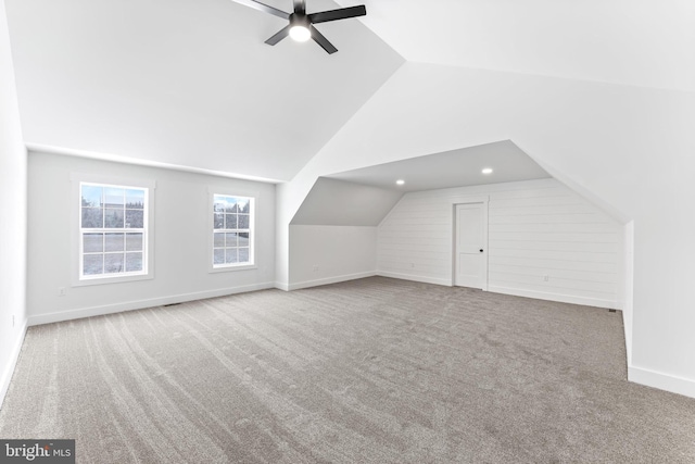 additional living space featuring lofted ceiling, recessed lighting, light colored carpet, ceiling fan, and baseboards