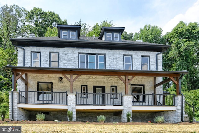 rear view of house with covered porch