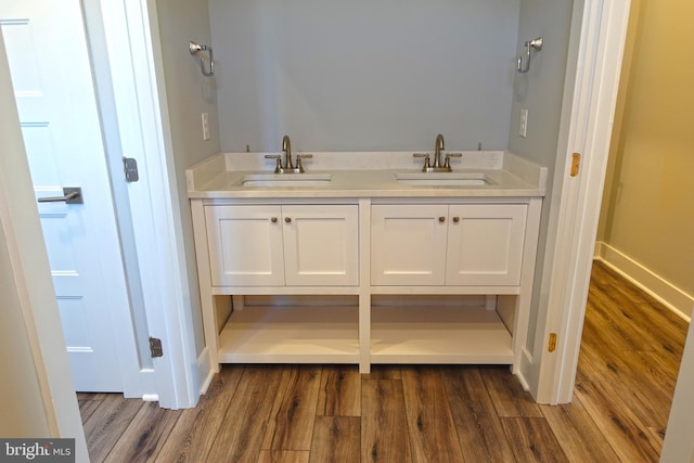 bathroom with vanity and hardwood / wood-style flooring