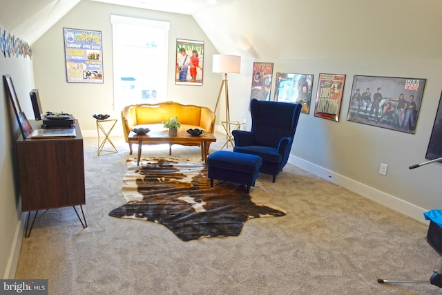 living area featuring light colored carpet and lofted ceiling