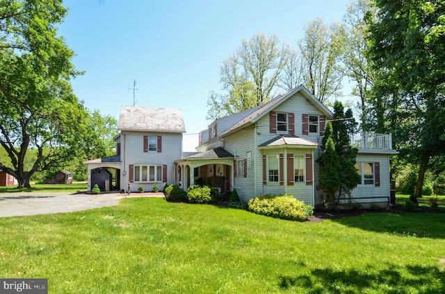 view of front of property featuring a garage and a front lawn