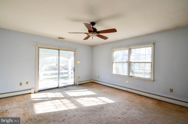 spare room featuring a baseboard radiator, a wealth of natural light, and ceiling fan