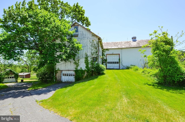 view of property exterior featuring a yard