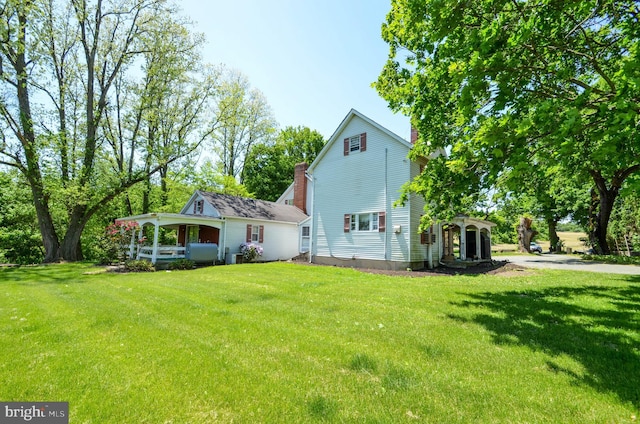 exterior space featuring a lawn