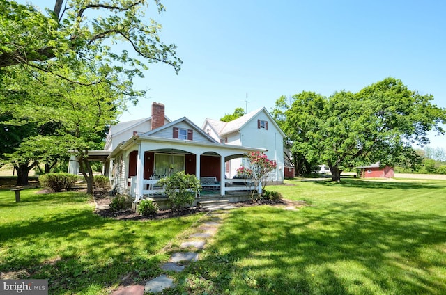 view of front of home with a front lawn and covered porch