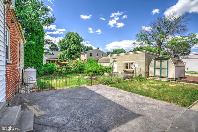 view of patio with a storage shed