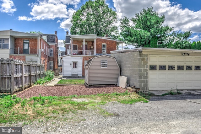 back of house featuring a garage