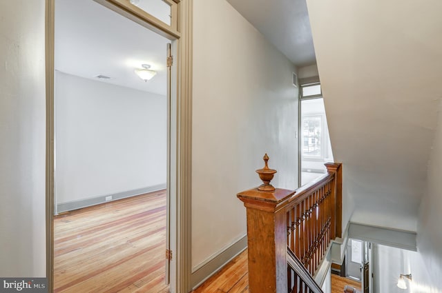 stairway featuring wood-type flooring