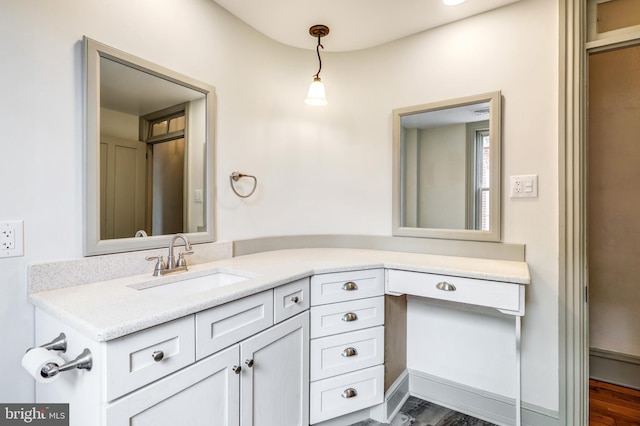 bathroom featuring vanity and hardwood / wood-style flooring