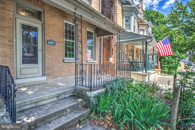 property entrance featuring covered porch