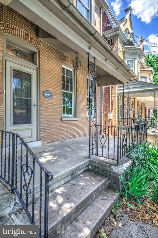 entrance to property with a porch