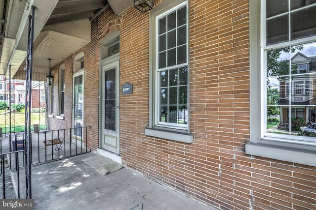 entrance to property featuring covered porch