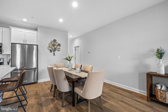 dining area featuring dark hardwood / wood-style floors