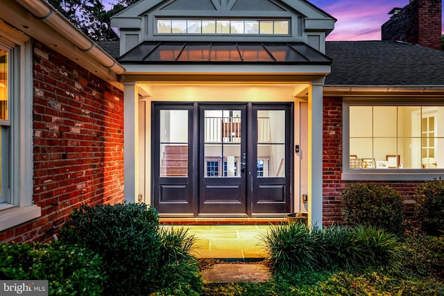 exterior entry at dusk with french doors