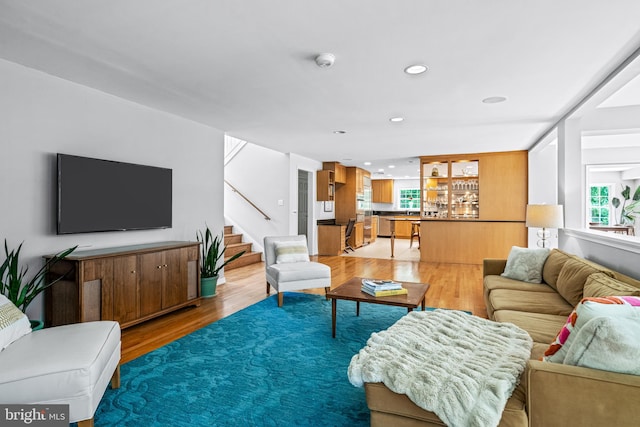 living room with light hardwood / wood-style flooring