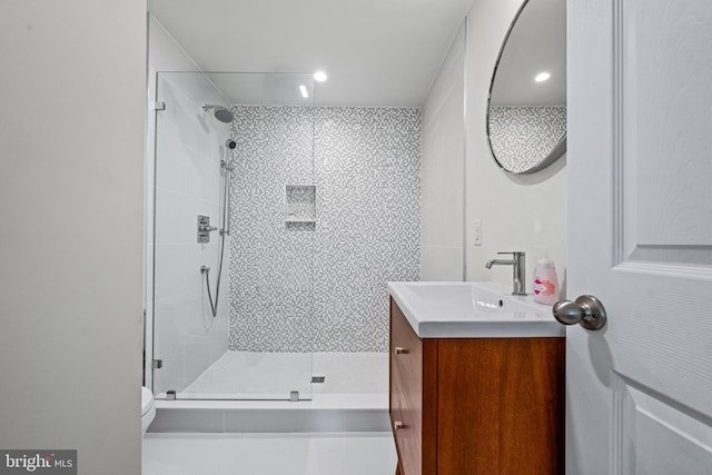 bathroom with vanity, walk in shower, and toilet