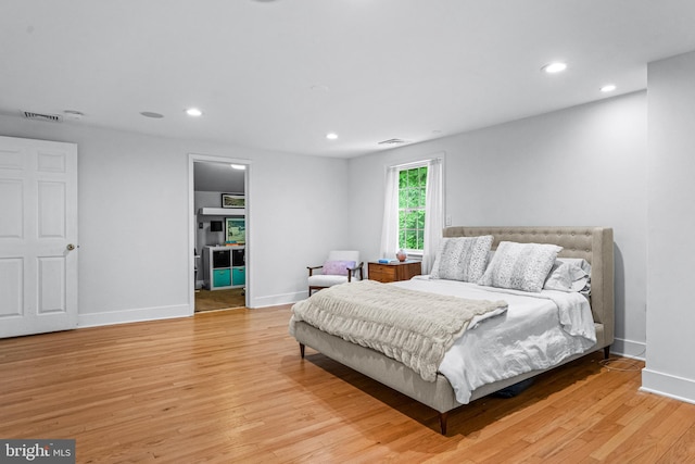 bedroom with light hardwood / wood-style flooring