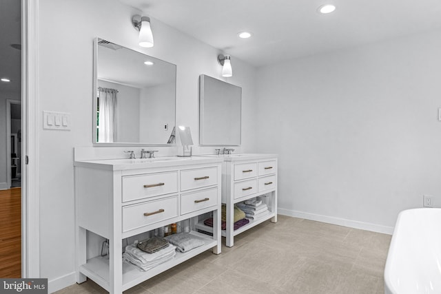 bathroom featuring tile patterned flooring and dual vanity