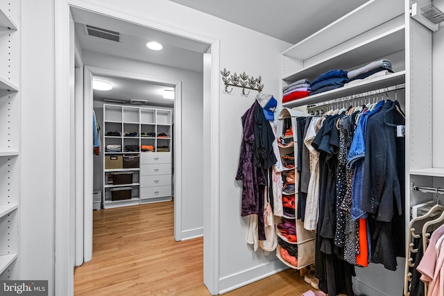 spacious closet featuring light wood-type flooring