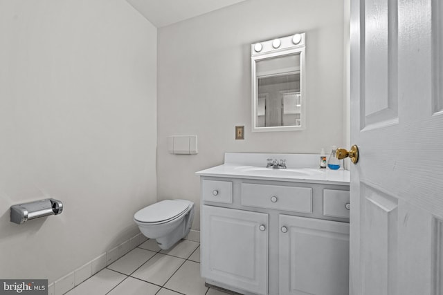 bathroom with vanity, toilet, and tile patterned floors