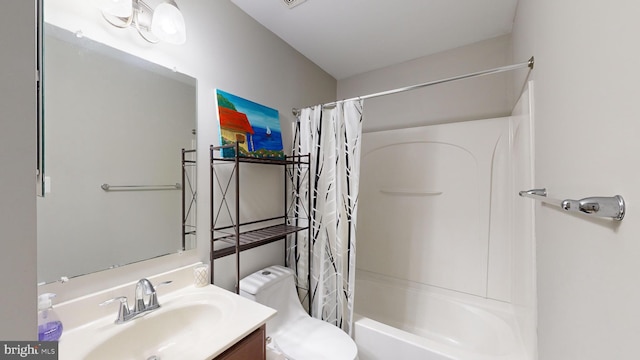 full bathroom with shower / bath combination with curtain, vanity, and toilet