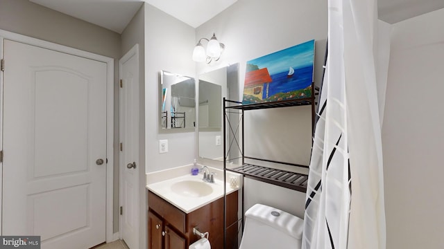 bathroom with vanity and toilet