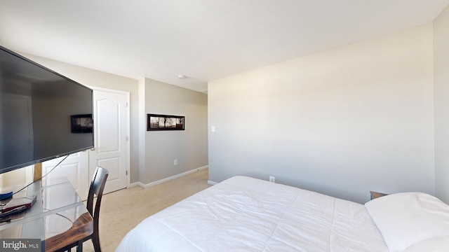 bedroom featuring light colored carpet