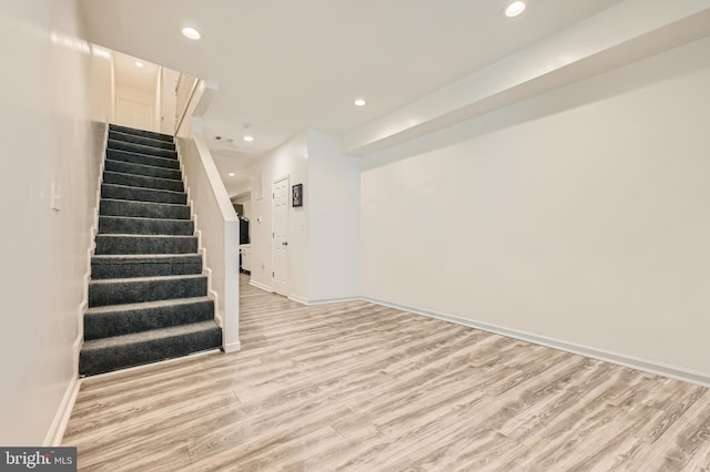 stairway with wood-type flooring