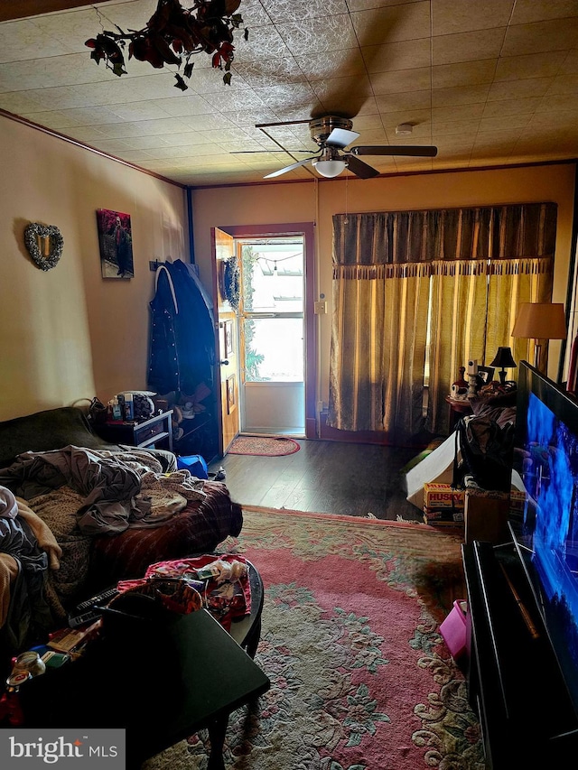 bedroom with ceiling fan and wood-type flooring