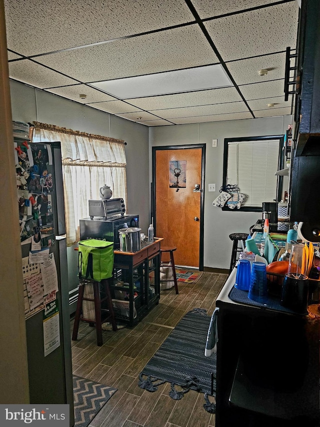 office area with a drop ceiling