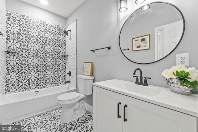 full bathroom featuring tile patterned floors, vanity, toilet, and tiled shower / bath combo