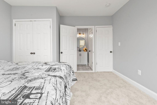 bedroom with light carpet and a closet