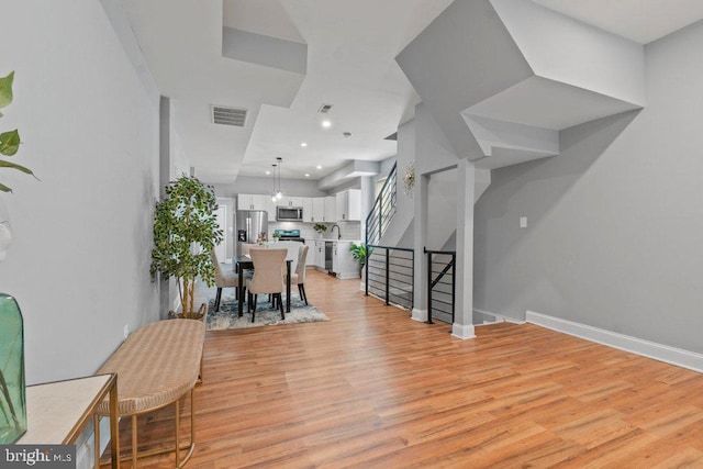 interior space with sink and light hardwood / wood-style flooring