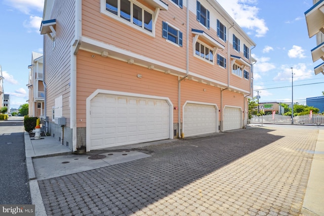 view of property exterior featuring a garage