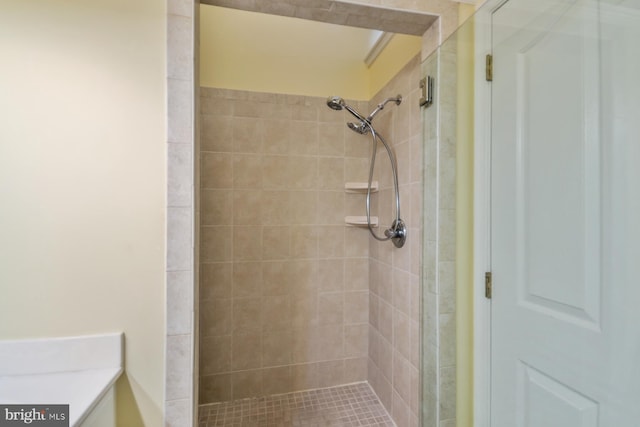 bathroom with tiled shower