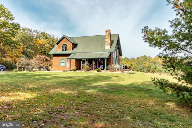 view of front of house with a front lawn and covered porch