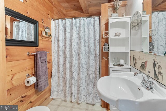 bathroom featuring wood ceiling, sink, toilet, and tile patterned floors