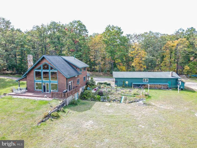 rear view of property with a yard