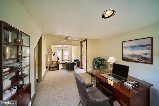 carpeted home office with ceiling fan