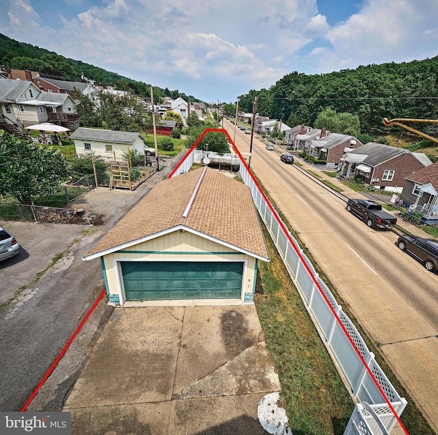 birds eye view of property with a residential view