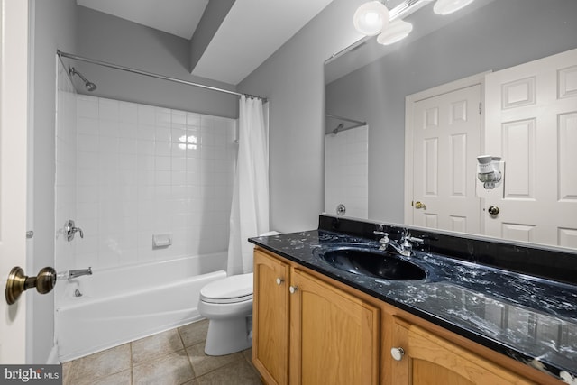 full bathroom featuring tile patterned flooring, toilet, vanity, and shower / tub combo