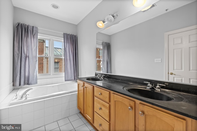 full bath featuring tile patterned flooring, a garden tub, a sink, and double vanity