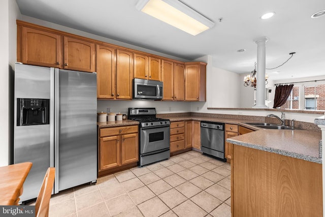 kitchen featuring light tile patterned floors, appliances with stainless steel finishes, a sink, and brown cabinets