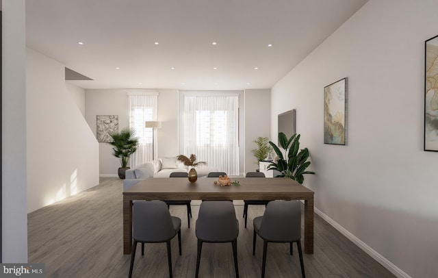 dining room featuring recessed lighting, baseboards, and wood finished floors