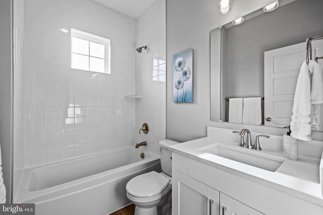 full bathroom with toilet, vanity, and bathing tub / shower combination