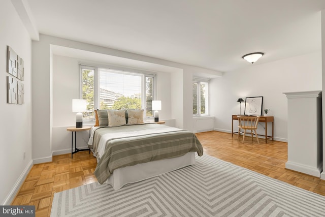 bedroom with light parquet floors