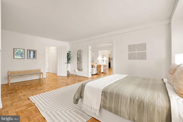 bedroom featuring light parquet floors