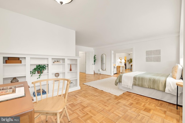 bedroom with light parquet floors